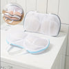 White mesh laundry bag designed to fold for storing bras and lingerie.