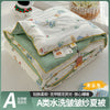 A lightweight summer quilt featuring a playful cartoon print with floral designs.
