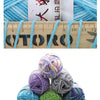 A pile of multicolored milk cotton blend yarn balls showing various shades of blue, purple, green, and gray.