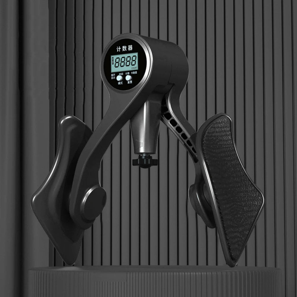 A close-up view of an adjustable hip and thigh trainer device with a digital display.