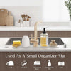 A small organizer mat featuring silicone items like a cup, dish towel, brush, and soap for kitchen or bathroom use.