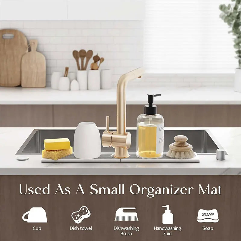 A small organizer mat featuring silicone items like a cup, dish towel, brush, and soap for kitchen or bathroom use.