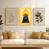 A vintage rotating candy display frame with a yellow background and a dust cover is displayed on a wooden shelf.