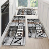 A set of rectangular kitchen mats with wood grain patterns and non-slip backing displayed on a light wooden floor.