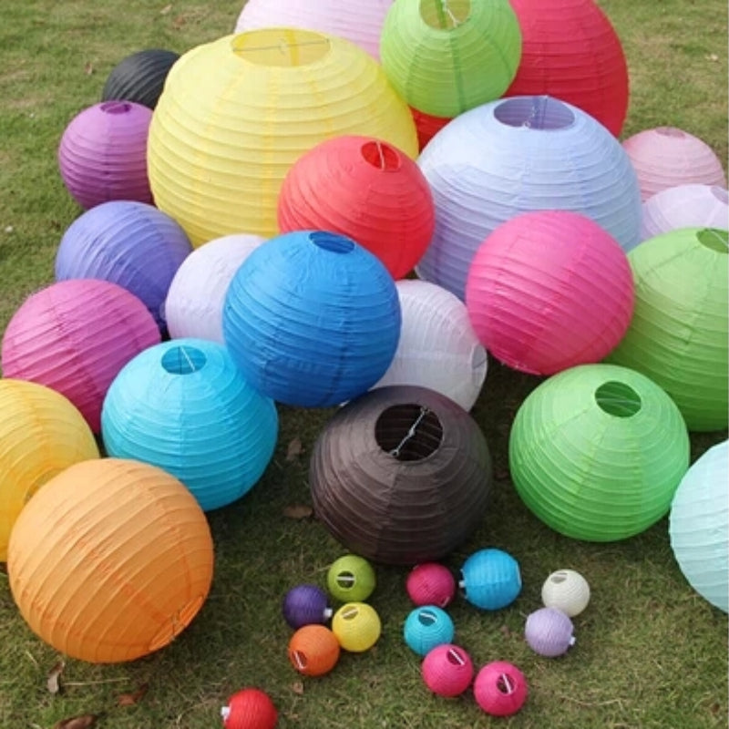 A collection of colorful round paper lanterns in various shades including pink, yellow, green, and blue.