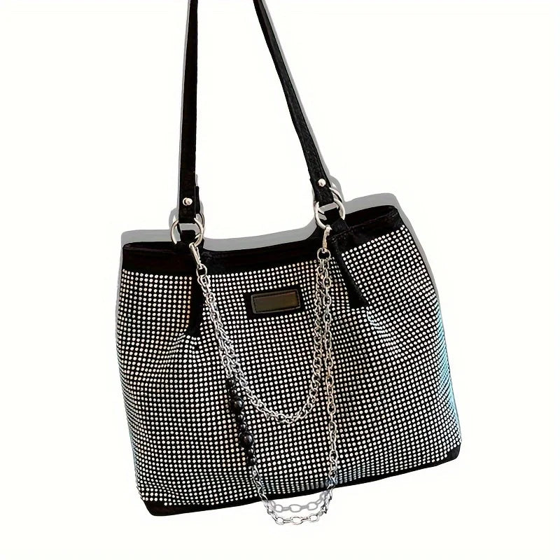 A black crystal-embellished chain shoulder bag with a textured pattern and gold hardware.