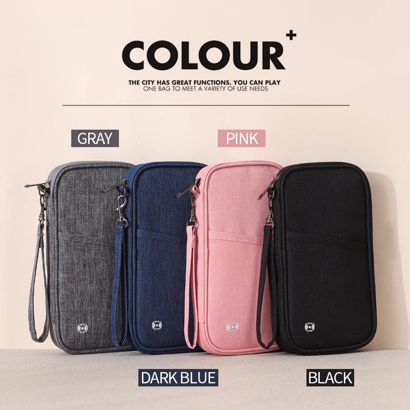 A set of four RFID-blocking passport holders in gray, dark blue, pink, and black are displayed on a light background.