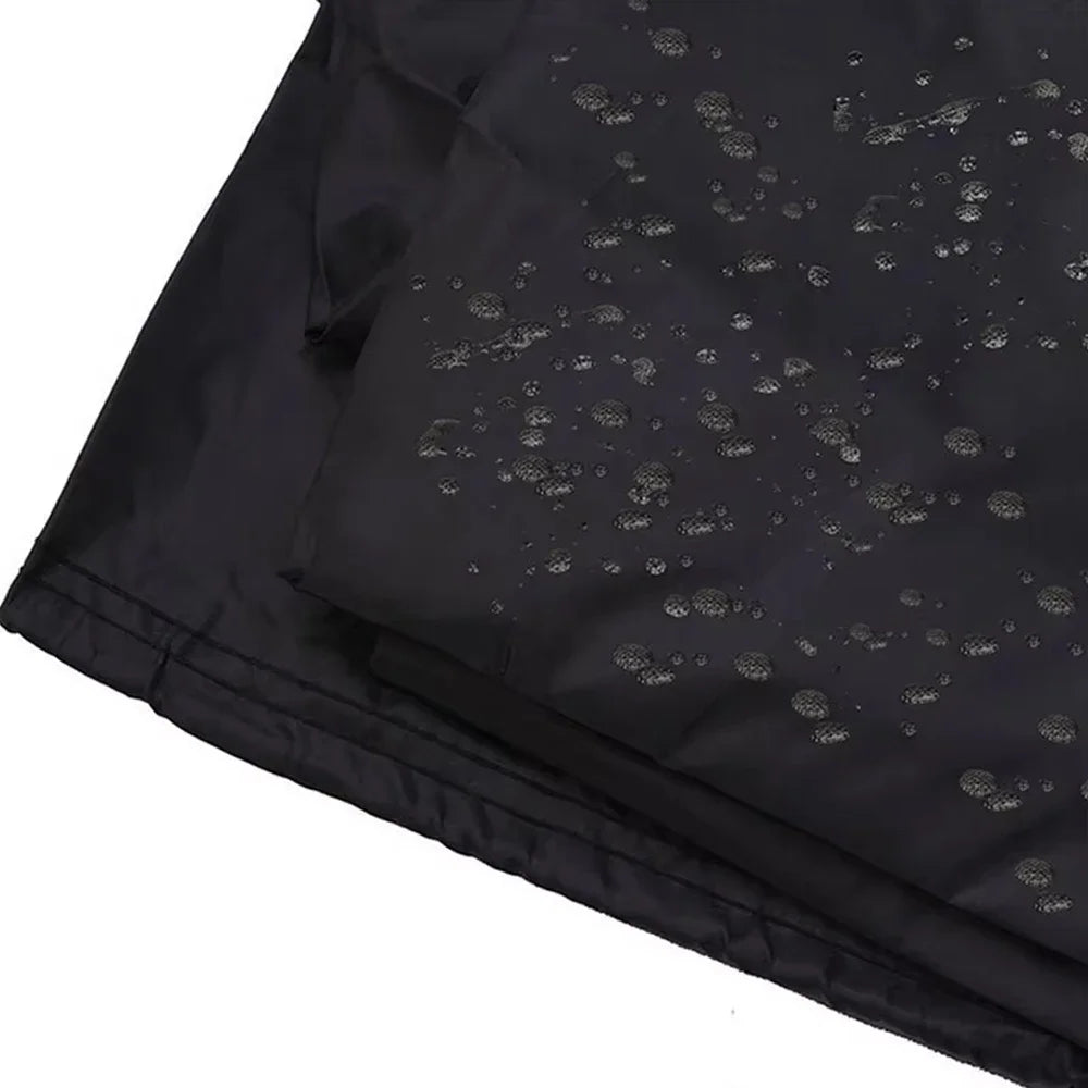 Black heavy-duty waterproof BBQ grill cover with small perforations