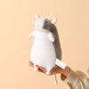 A white and gray plush mouse stuffed animal being held in a person's hand.
