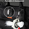 A white reusable fluorescent cable tie is attached to a black backpack using a mountaineering buckle design.