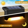 A solar-powered LED step light is shown with a solar panel on top and a bright light emitting from the bottom, demonstrating 