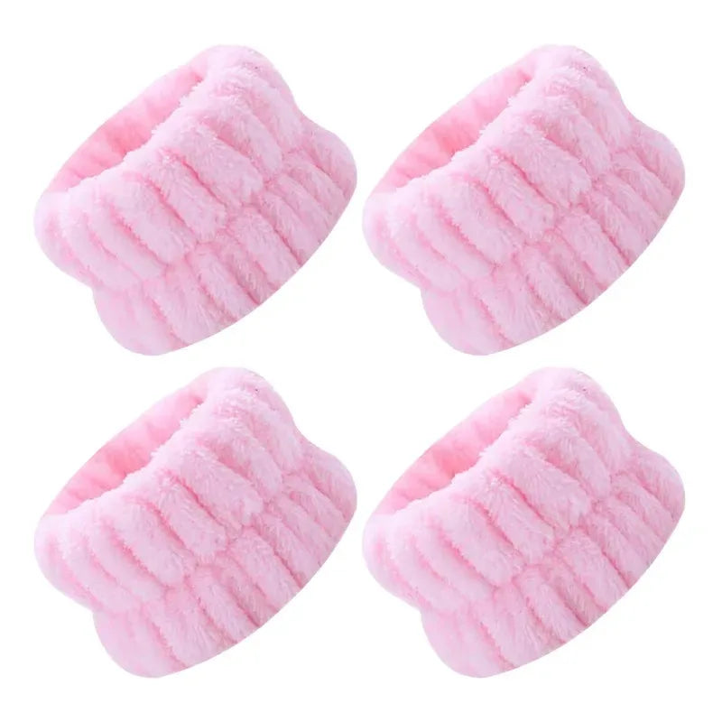 Pink microfiber wrist washing bands or face-saving cuffs with a ribbed texture