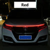 Close-up of a car's front grille showing a red LED engine hood light strip with a scan effect.