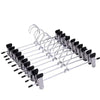 A set of five anti-slip stainless steel hangers with clips for pants and skirts.