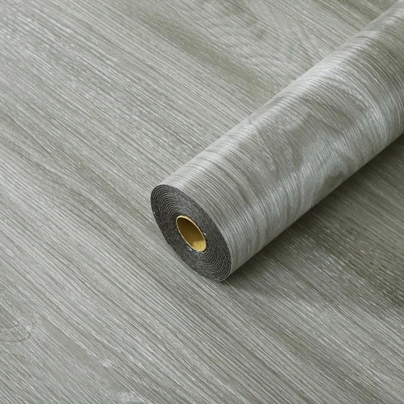 Roll of self-adhesive wood grain floor stickers in gray for peel-and-stick wallpaper