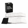 A black box of Cards Against Humanity game with multiple decks of white cards displayed in front.