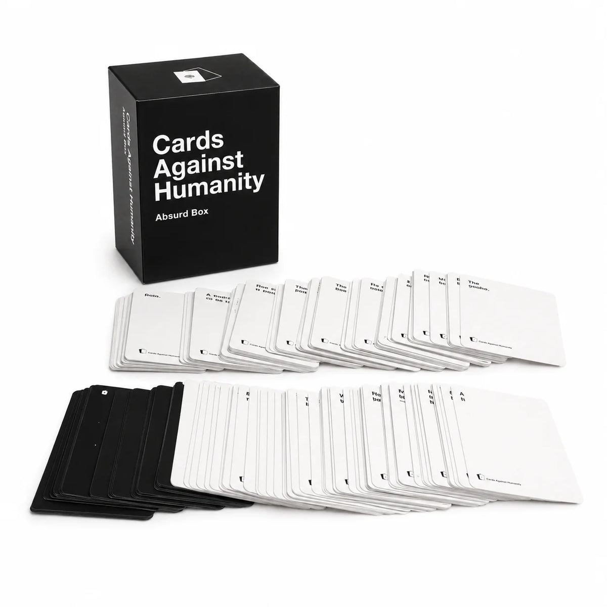 A black box of Cards Against Humanity game with multiple decks of white cards displayed in front.