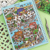 A colorful sticker book featuring miniature scenes and 3D house crafts depicting a bustling village or landscape.