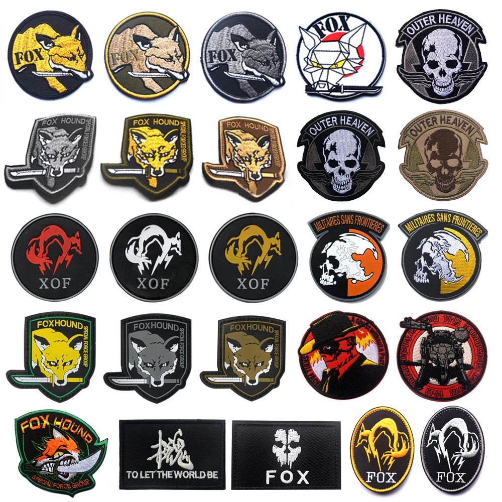 A collection of embroidered patches featuring various foxhound designs and skull motifs on black, gold, and olive backgrounds