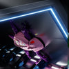A purple wall-climbing gecko toy with pink body and LED eyes is displayed in a futuristic, illuminated display box.