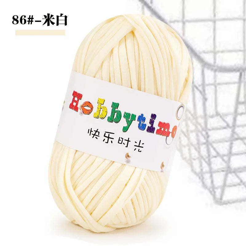 A ball of white soft T-shirt yarn for crochet and knitting used for making items like baskets and slippers.