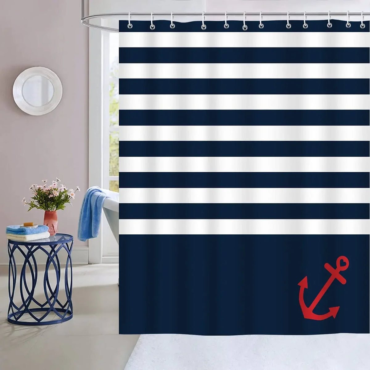 Navy blue and white striped fabric shower curtain hanging from a metal rod
