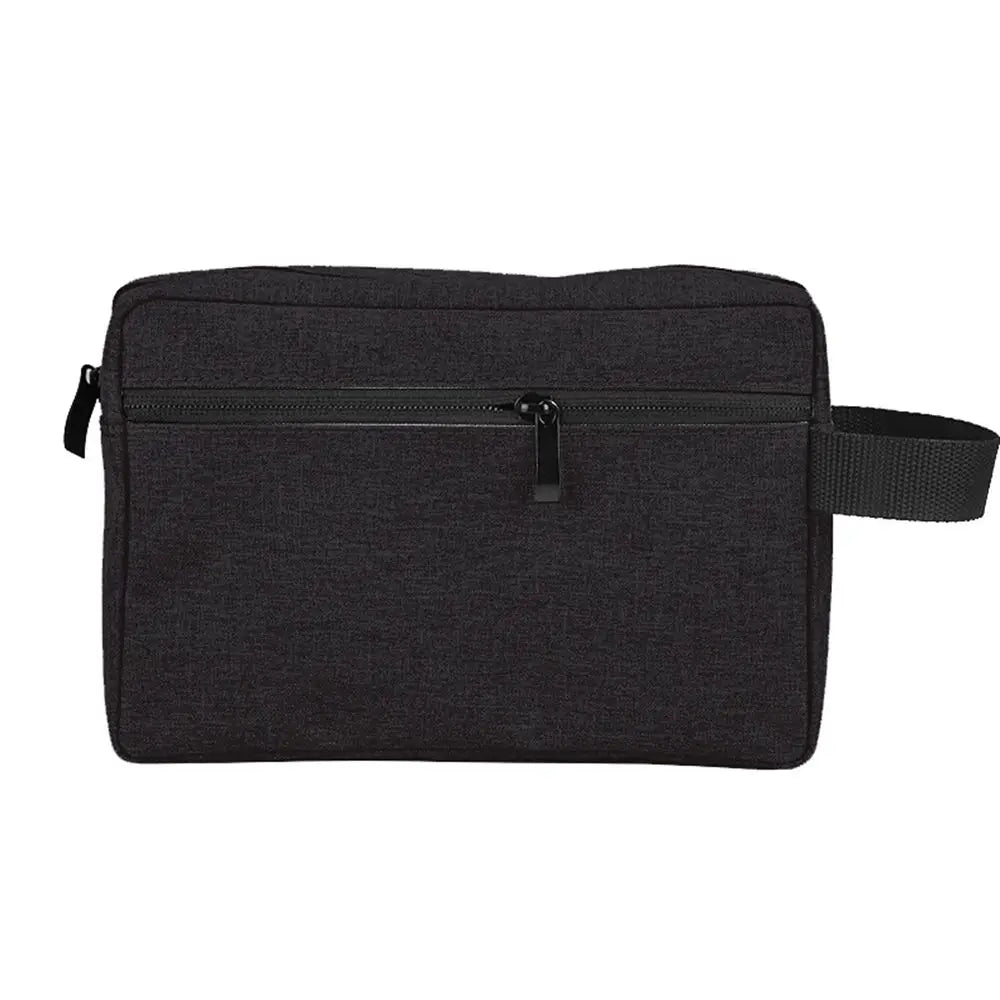 A black compact canvas toiletry bag with a zipper and strap.
