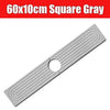 A gray square silicone mat with raised ridges and a hole, used as a quick-dry faucet mat.