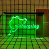 A neon sign shaped like the state of Nuremberg in bright green light displayed within a black frame.
