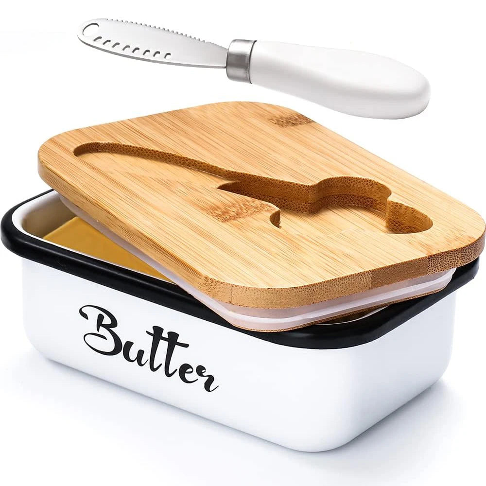 A white butter dish with a wooden lid and a stainless steel knife resting on the dish.