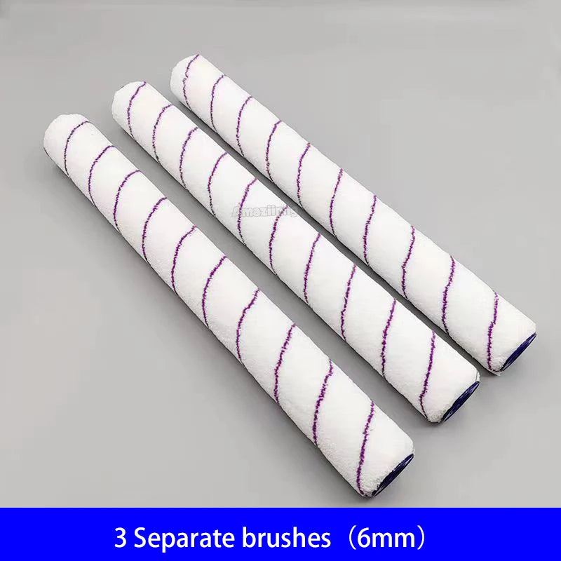 Three white paint brushes with purple stripes are displayed on a gray background.