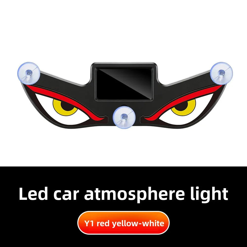A black demon eye LED car window decal with yellow and red lights.