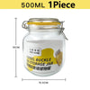A clear glass mason jar with a yellow lid and a metal clamp, labeled as a steel buckle storage jar.