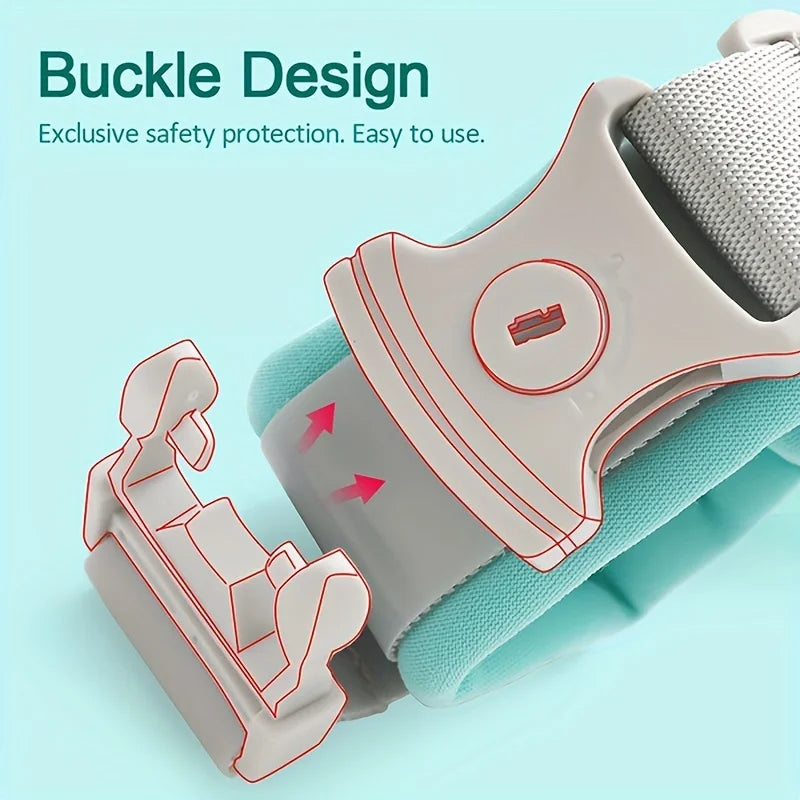 A close-up of a light gray wrist link strap with a buckle design and a teal fabric strap, showing the safety features.