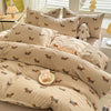 A set of beige duvet cover and pillowcases featuring a cute dog print design.