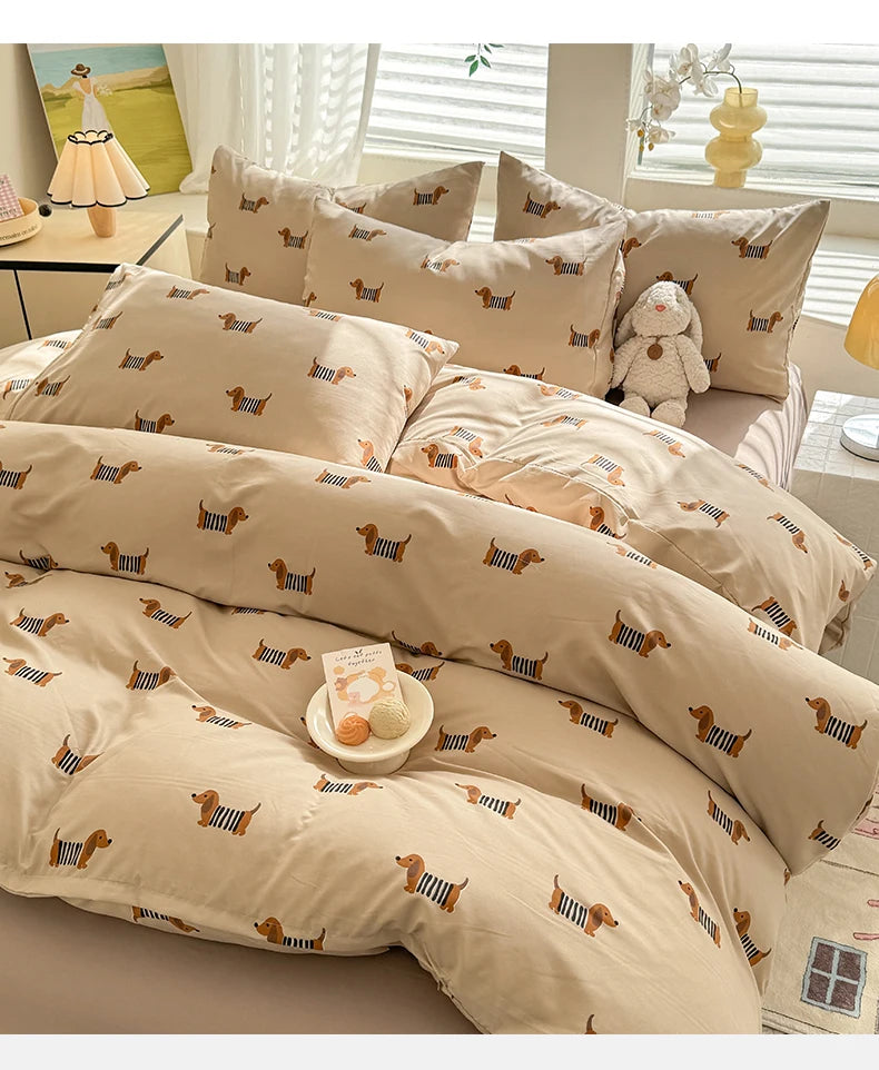 A set of beige duvet cover and pillowcases featuring a cute dog print design.
