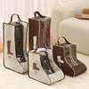Brown and beige waterproof boot storage bags with handles displayed on a light rug.