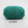 A ball of teal green 22-ply yarn for knitting and crochet.