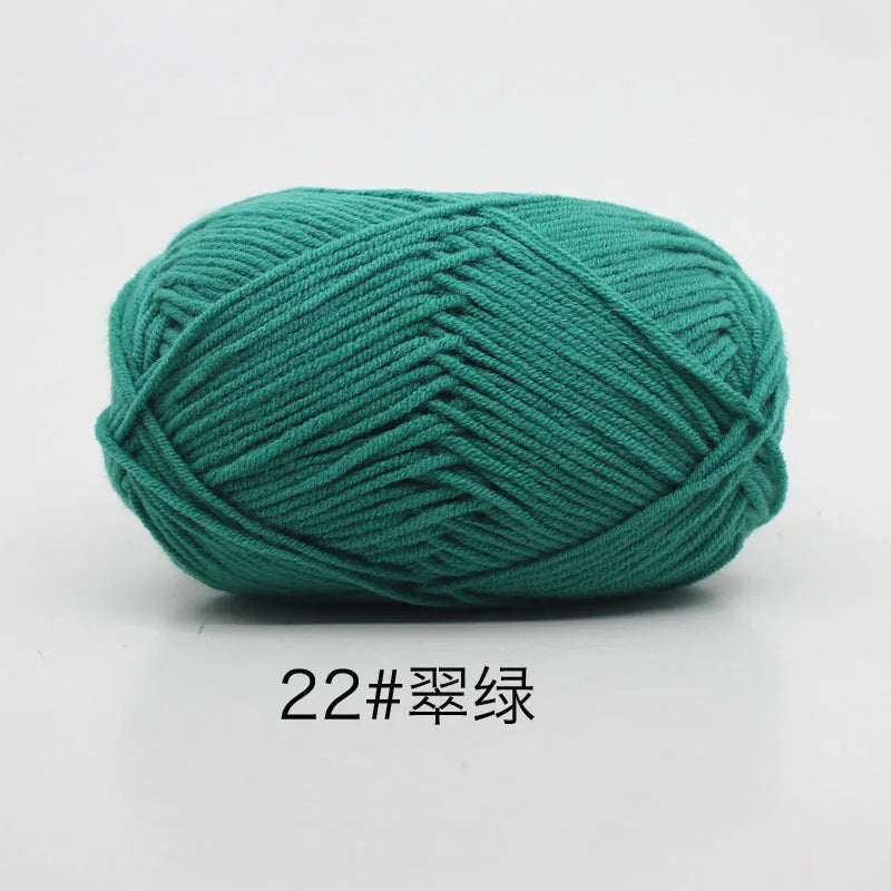 A ball of teal green 22-ply yarn for knitting and crochet.