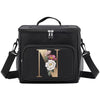 Black insulated canvas lunch bag with a gold initial N and adjustable straps