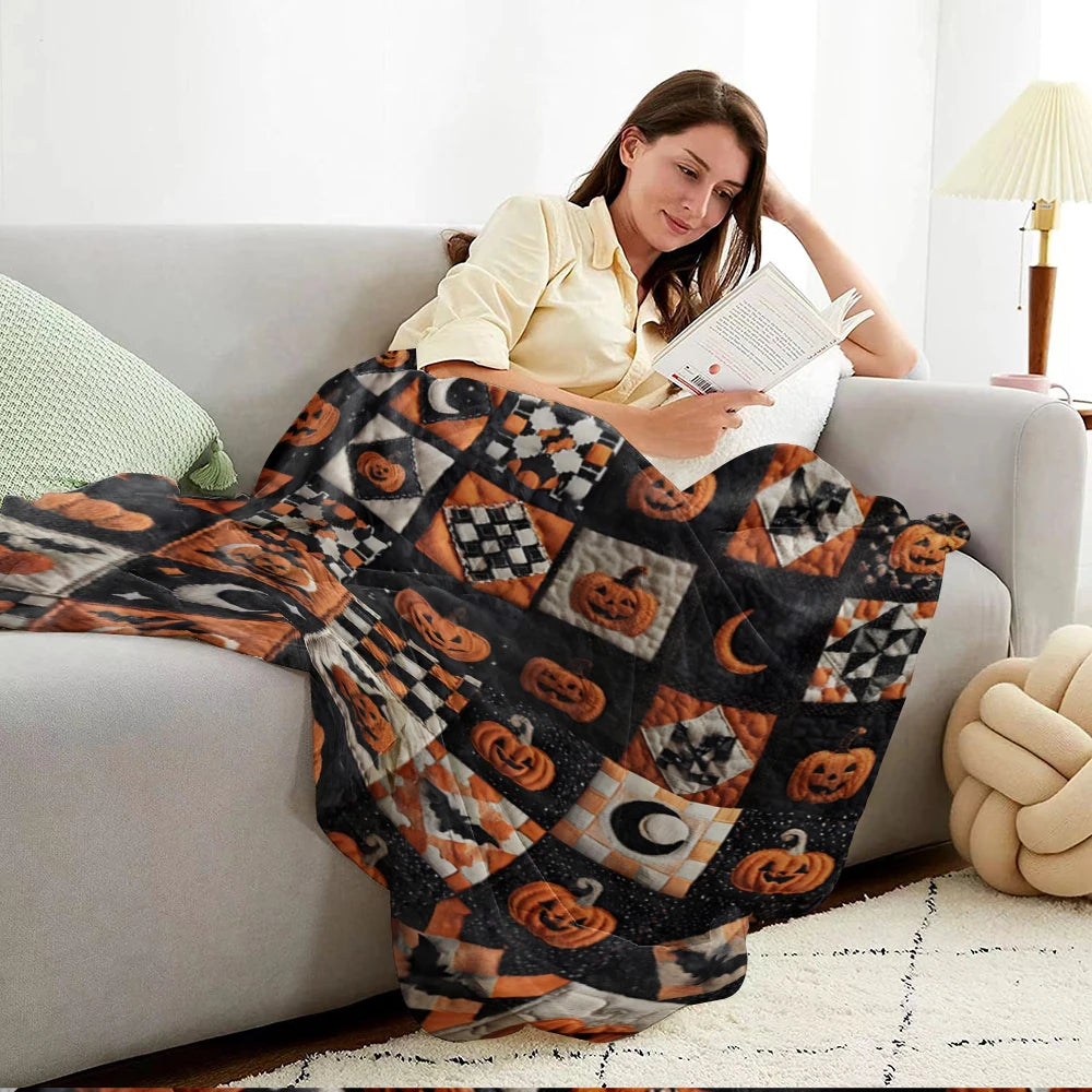 A woman relaxing on a sofa with a vintage patchwork Halloween throw blanket featuring pumpkin and moon prints.