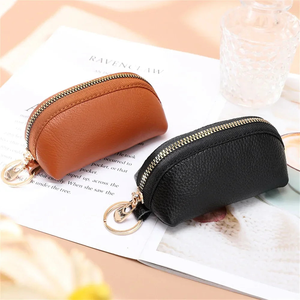 A brown and black PU leather key organizer wallet with zippers shown on a white background.