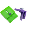 A bright green precision vinyl cutting tool with a measurement scale and a purple plastic holder.