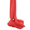 A tube of bright red slime or putty with a textured, wavy surface and a small green fruit attached.