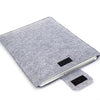 A gray felt laptop sleeve case designed for 11 to 15 inch devices.