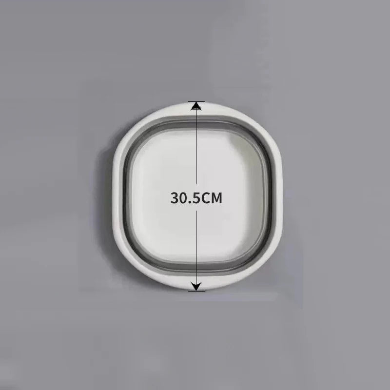 A white foldable plastic wash basin shown with a dimension of 30.5cm.