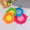 A collection of colorful acrylic non-stick dish sponges shaped like flowers in various shades of green, yellow, blue, and pin