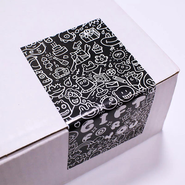 A black and white pattern of various gift-related icons is visible on a rectangular sealing sticker inside a white box.