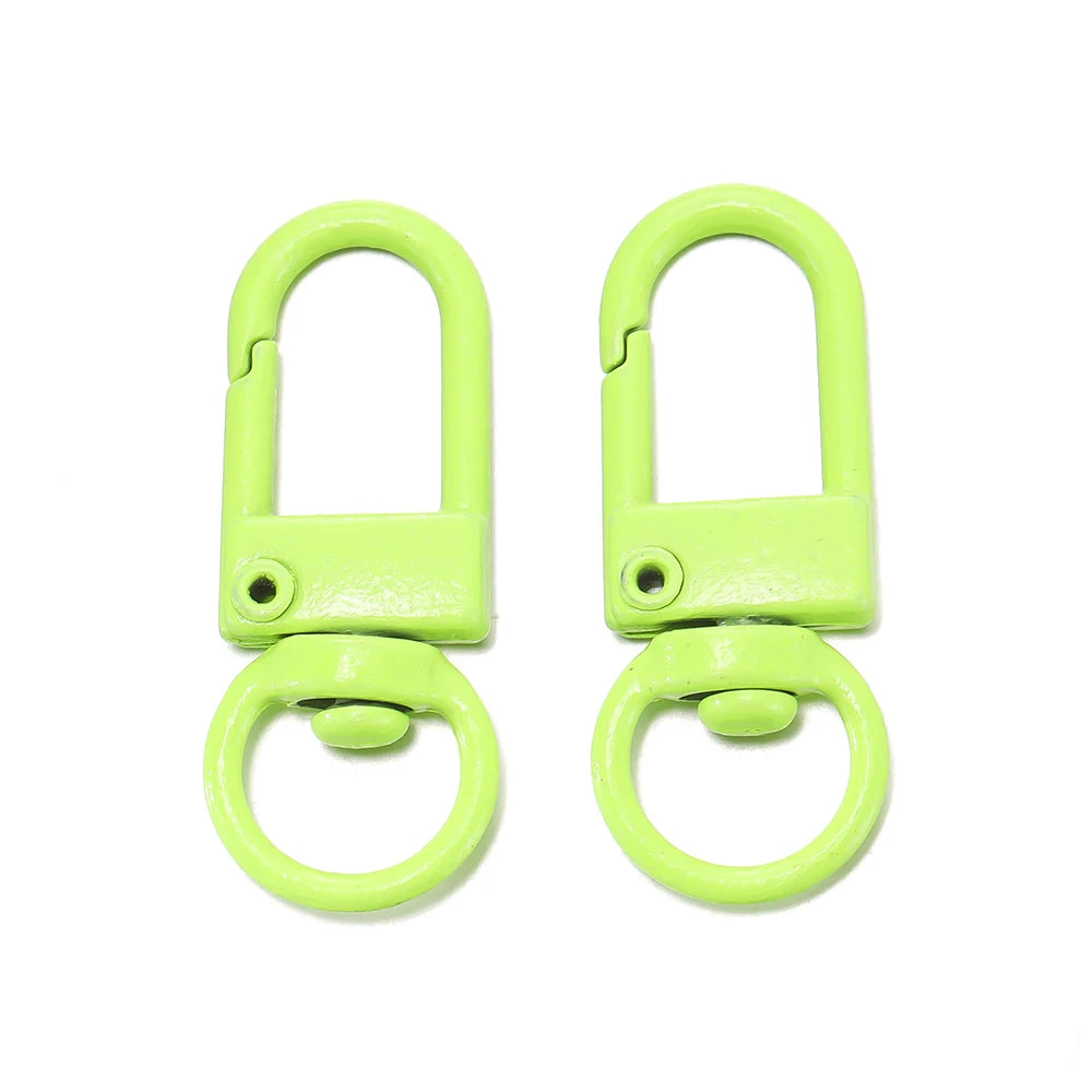 A pair of bright lime green alloy lobster clasp hooks for DIY jewelry making.