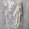 A white articulated BJD collectible figurine in a clear plastic blind box packaging.